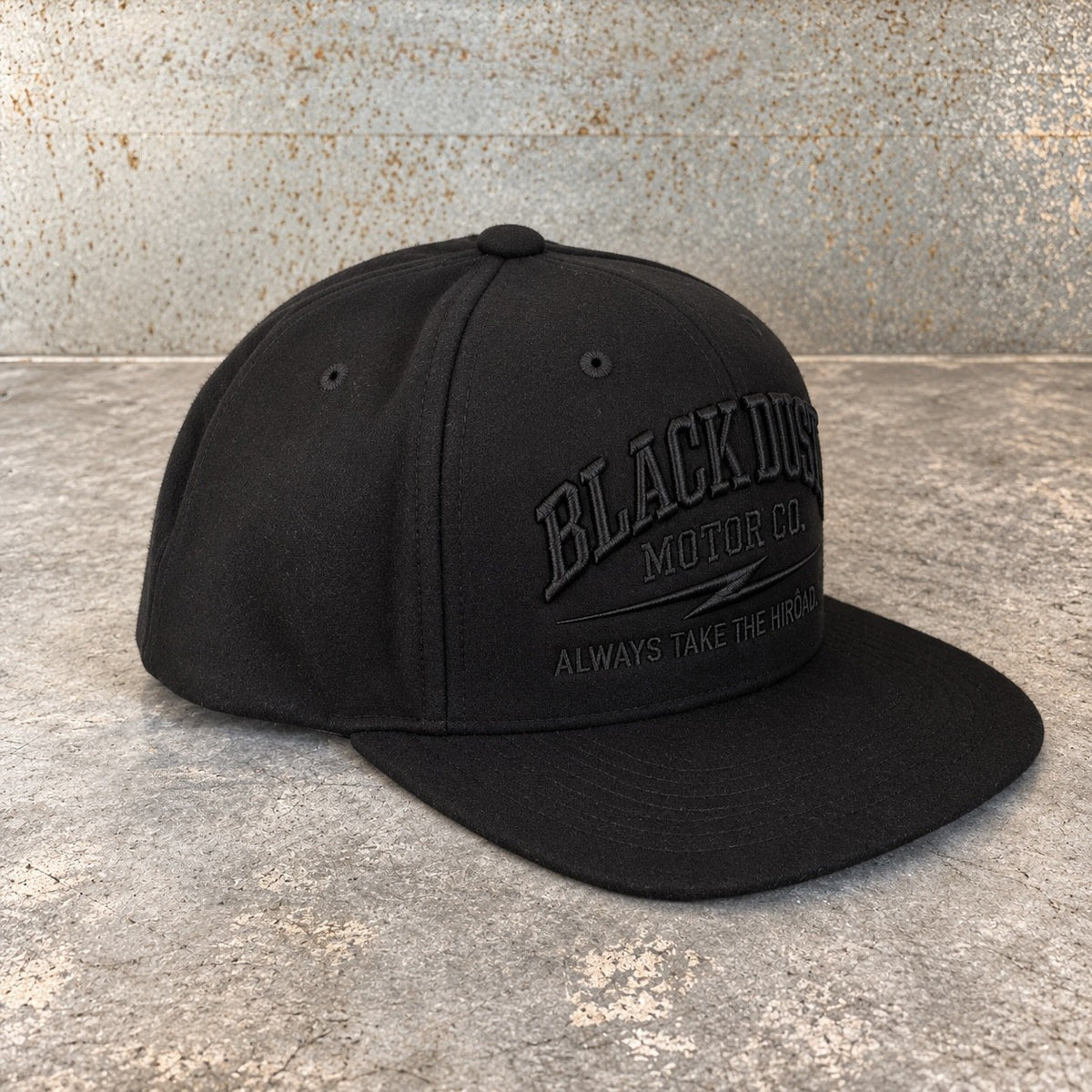 Black wool snapback, three-quarter view