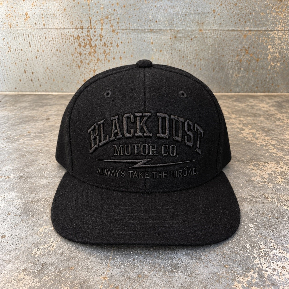 Black wool snapback with tone-on-tone embroidered Black Dust Motor Co. logo, front