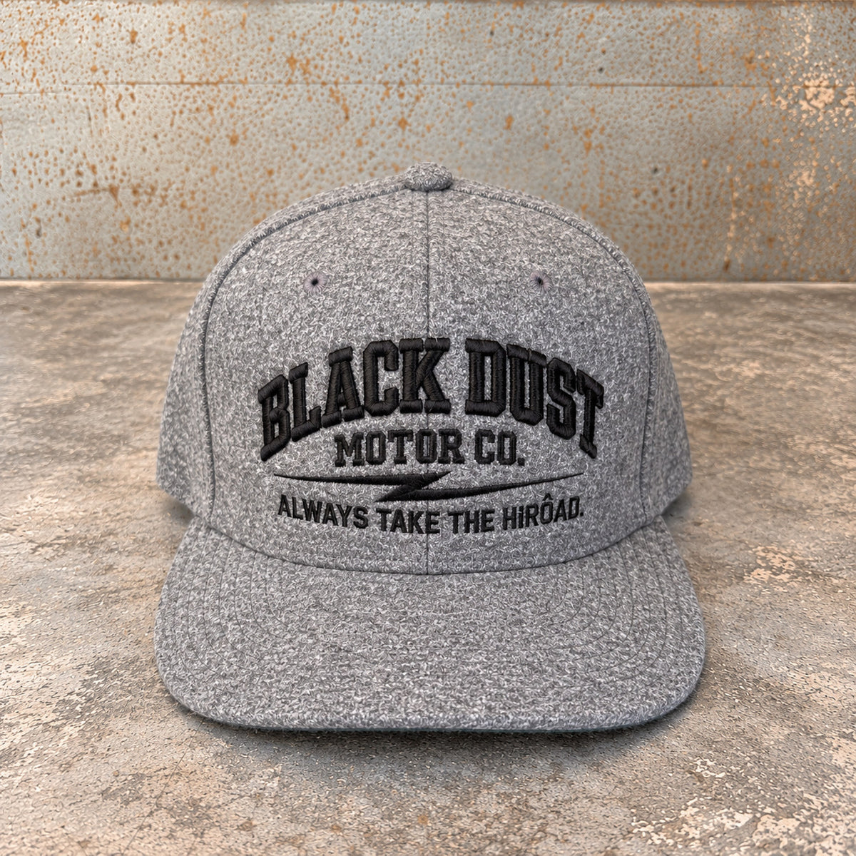 Heather grey wool snapback with black embroidered logo, front